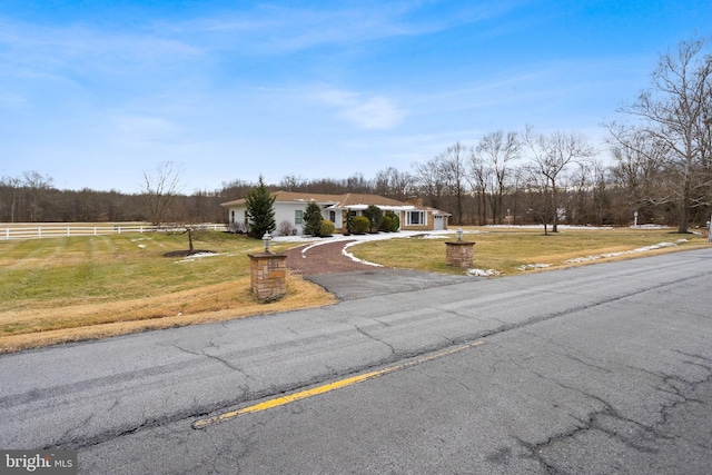 view of front of home featuring a front lawn