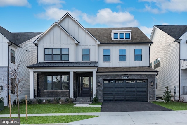 modern farmhouse with a garage and a front yard