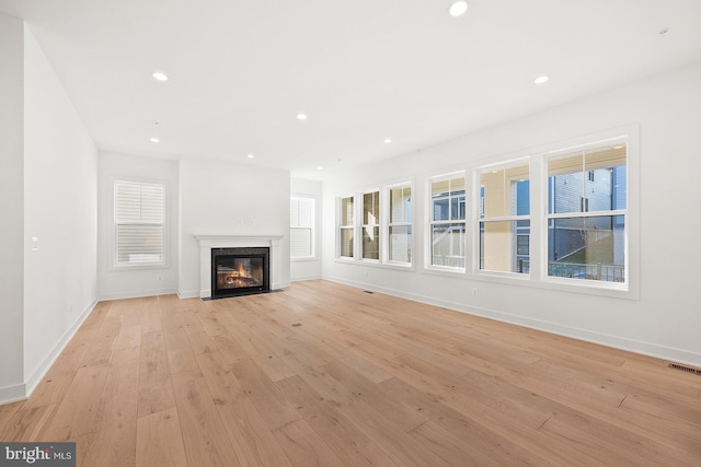 unfurnished living room featuring light hardwood / wood-style flooring