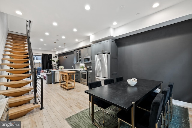 dining area with light hardwood / wood-style flooring