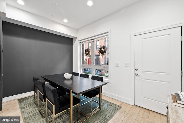 dining area with light hardwood / wood-style floors