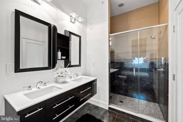 bathroom featuring vanity and a shower with shower door