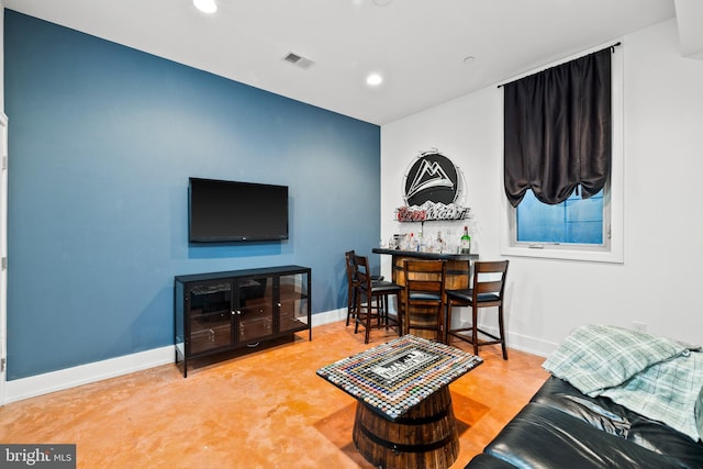 living room with concrete flooring