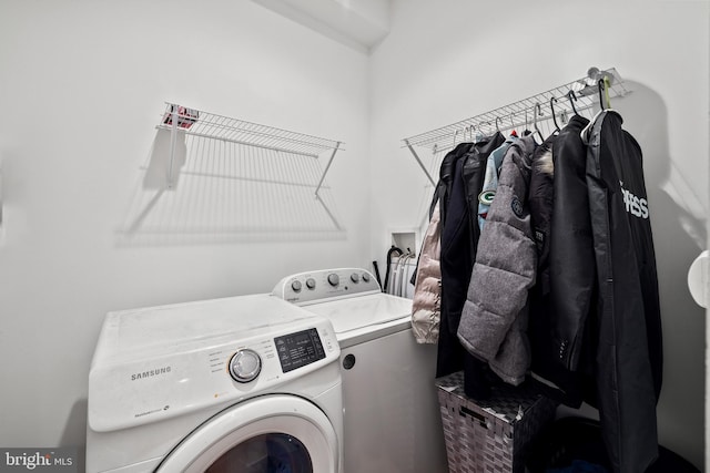 laundry area with separate washer and dryer