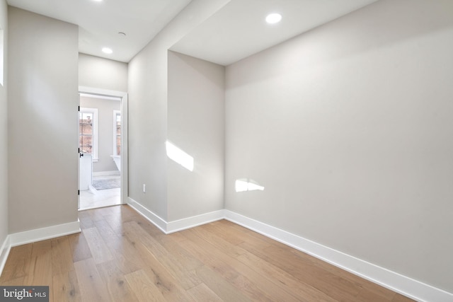 spare room with light hardwood / wood-style flooring