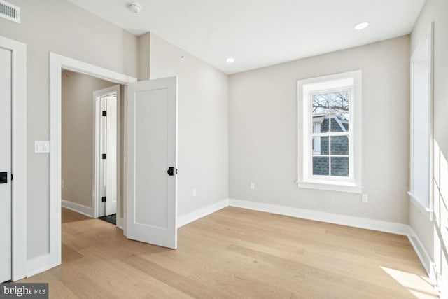 spare room with light wood-type flooring