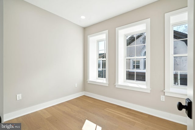 unfurnished room with light hardwood / wood-style floors