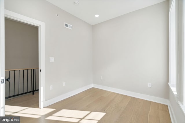 unfurnished room featuring light wood-type flooring