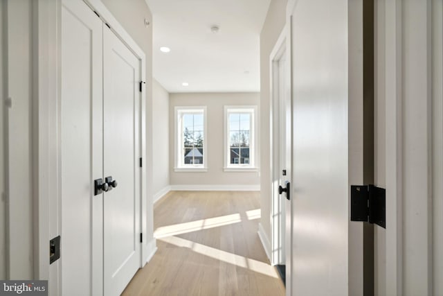 corridor featuring light hardwood / wood-style floors