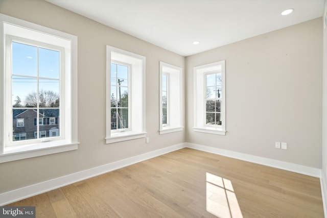 unfurnished room with light hardwood / wood-style flooring