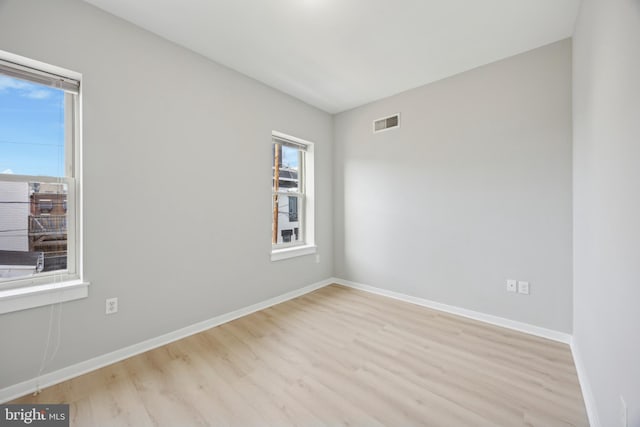 unfurnished room featuring light wood-type flooring