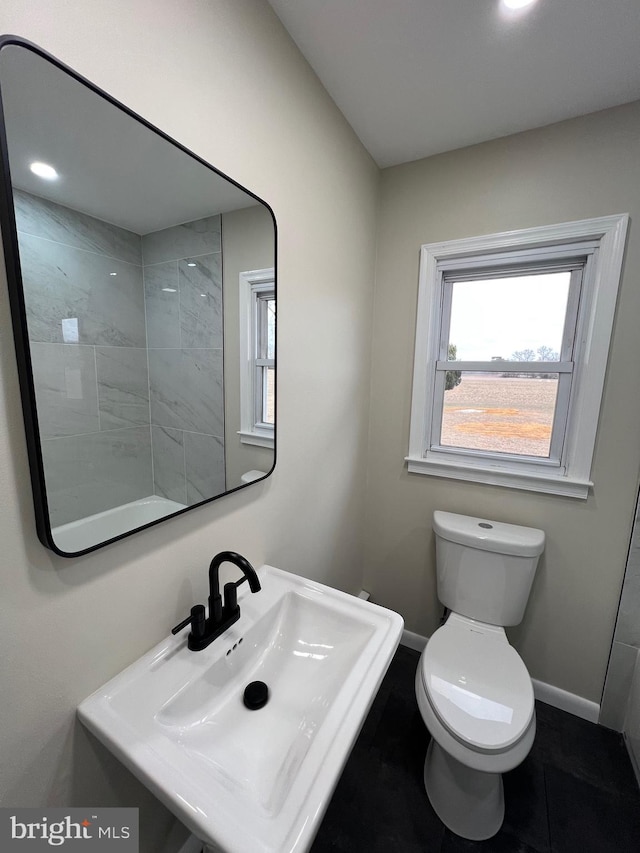 bathroom with sink and toilet