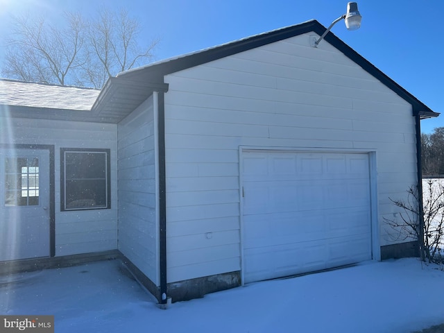 view of snow covered garage