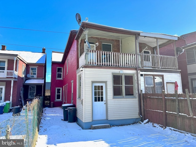 view of front of home with a balcony