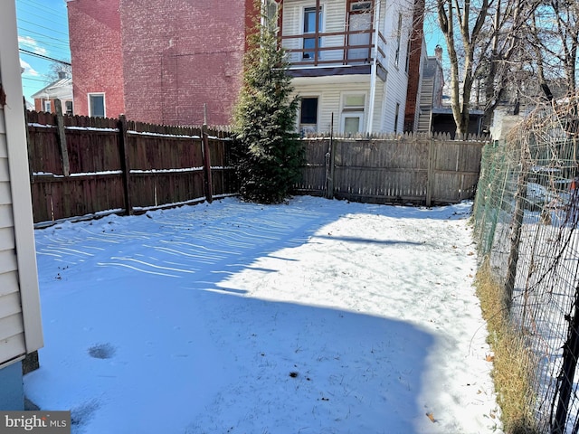 view of yard covered in snow