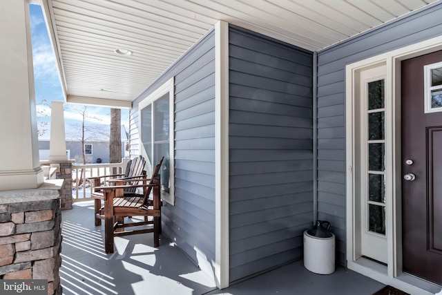 doorway to property featuring covered porch