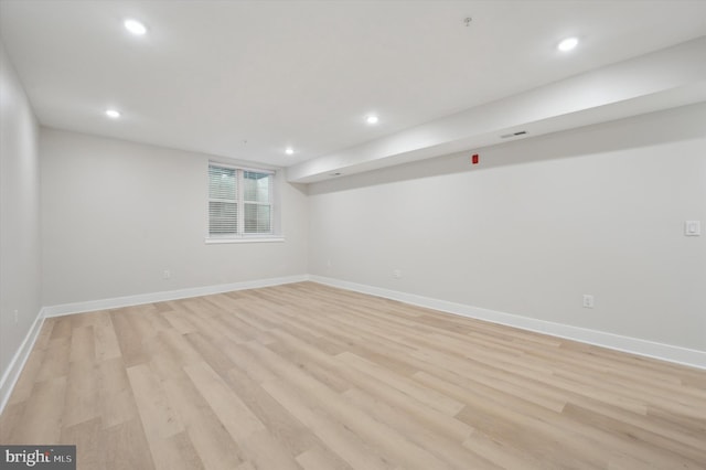 basement featuring light wood-type flooring