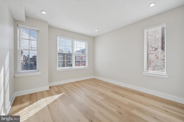 unfurnished room with light hardwood / wood-style flooring