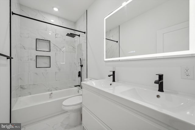 full bathroom featuring toilet, vanity, and tiled shower / bath