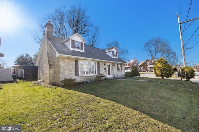 new england style home with a front yard