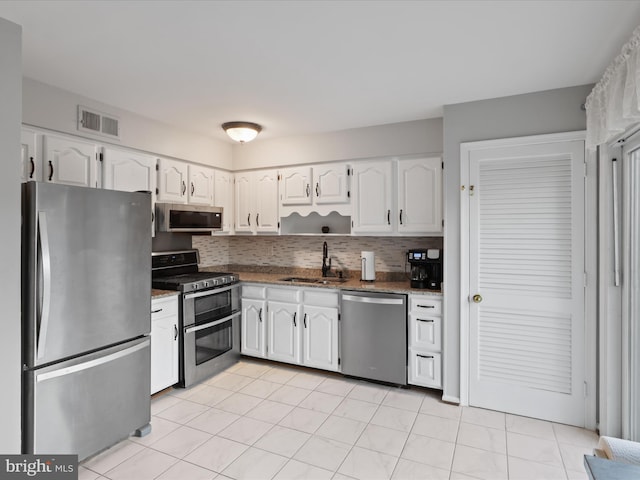 kitchen with white cabinets, sink, and appliances with stainless steel finishes