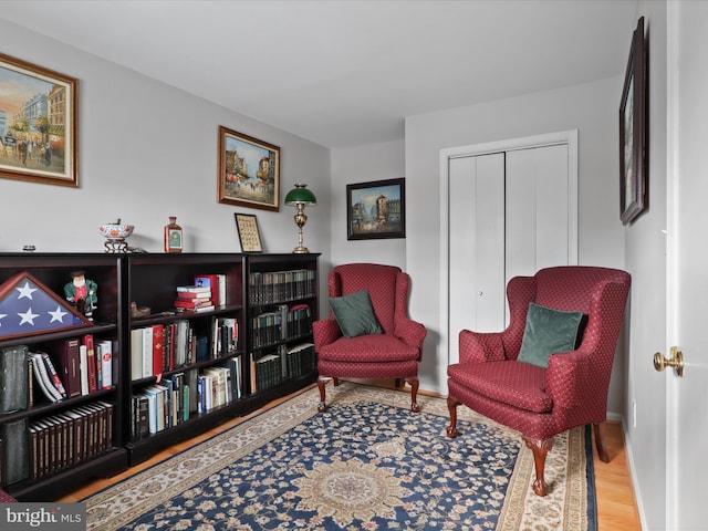 living area with hardwood / wood-style floors