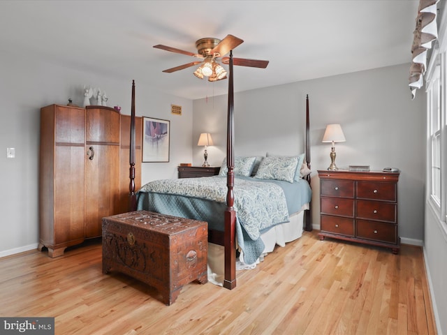 bedroom with light wood-type flooring and ceiling fan