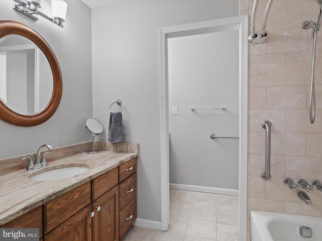 bathroom with vanity, tile patterned floors, and tiled shower / bath