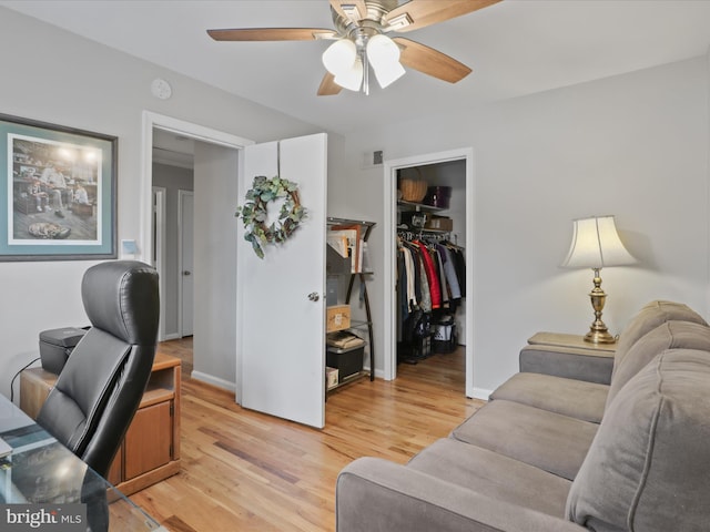 office area with ceiling fan and light hardwood / wood-style flooring