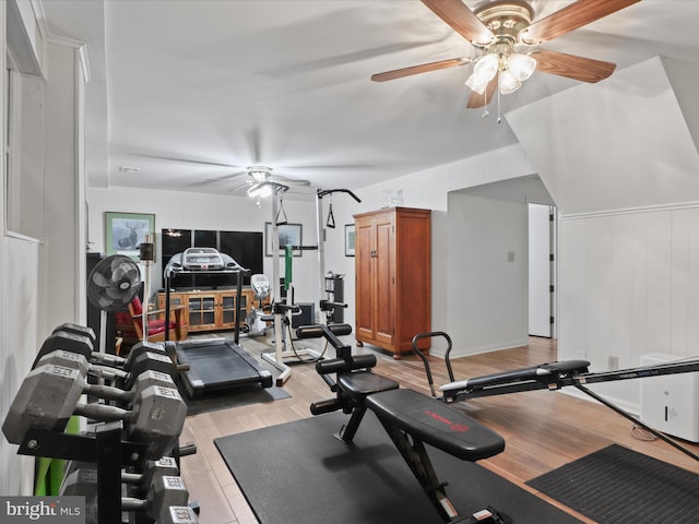 workout room featuring light wood-type flooring and ceiling fan