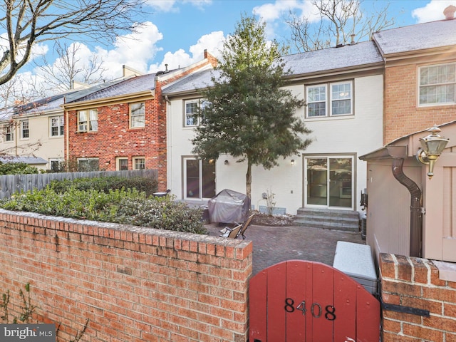 rear view of property with a patio area