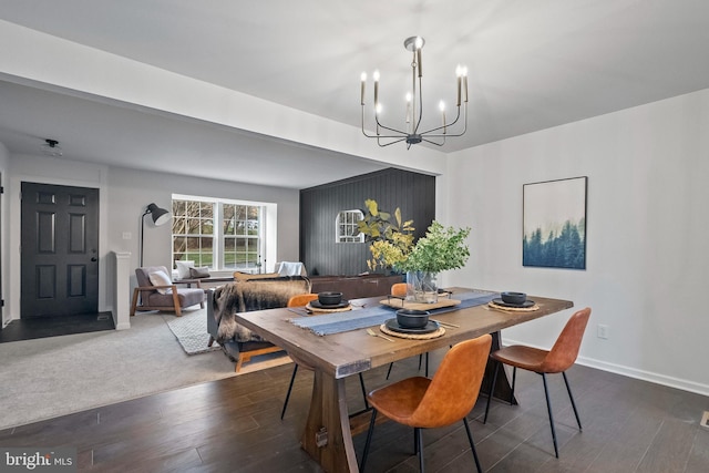 dining area with a chandelier and dark hardwood / wood-style floors