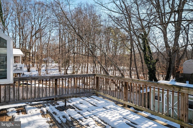 view of snow covered deck