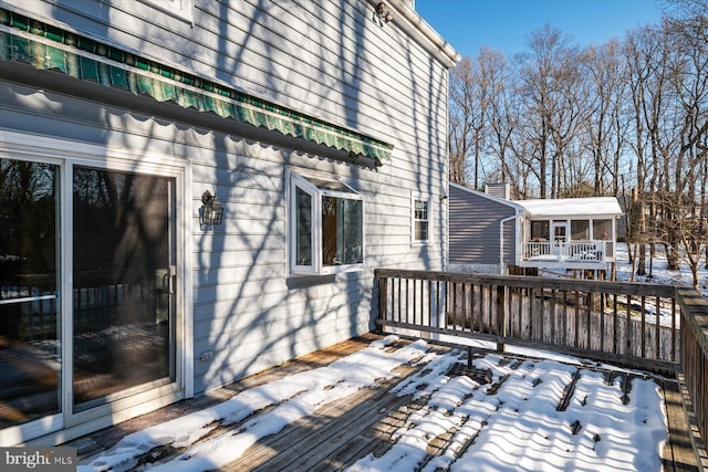 view of snow covered deck