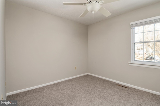 carpeted empty room with ceiling fan