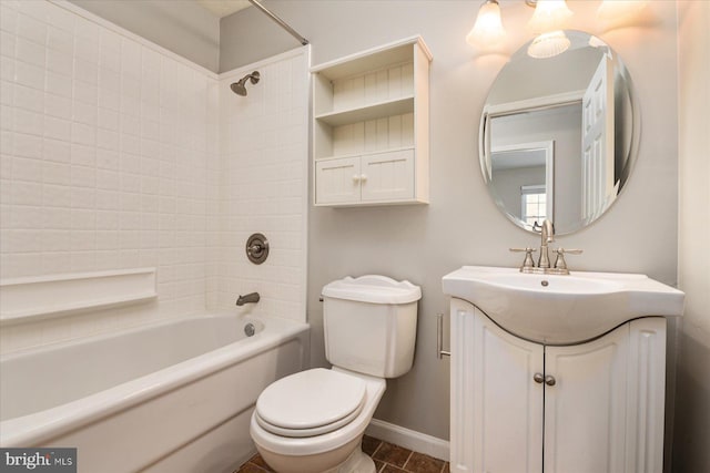 full bathroom featuring toilet, vanity, and tiled shower / bath combo