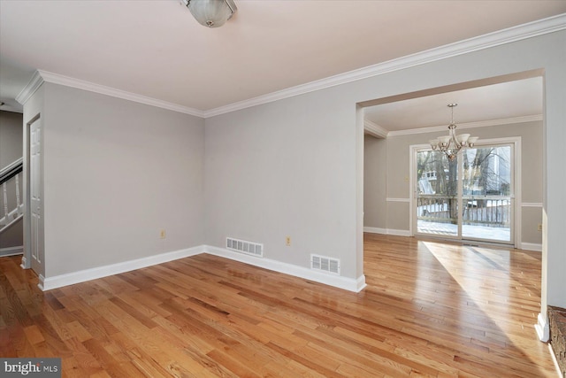 unfurnished room with a chandelier, crown molding, and light hardwood / wood-style flooring