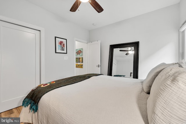 bedroom featuring hardwood / wood-style floors and ceiling fan