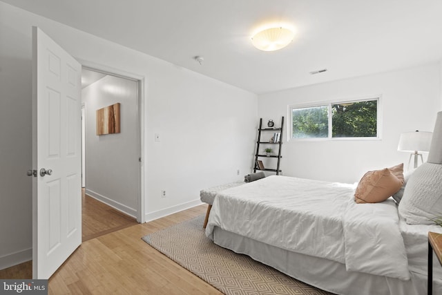 bedroom featuring hardwood / wood-style flooring