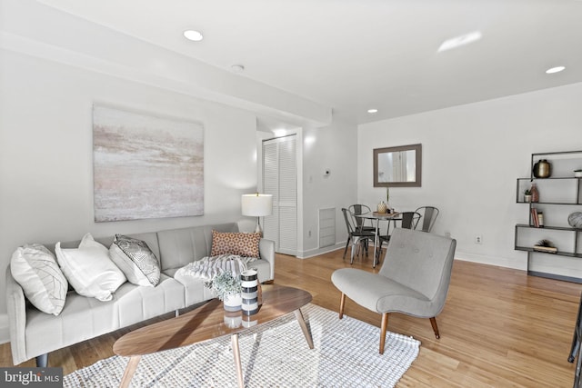 living room with light hardwood / wood-style flooring