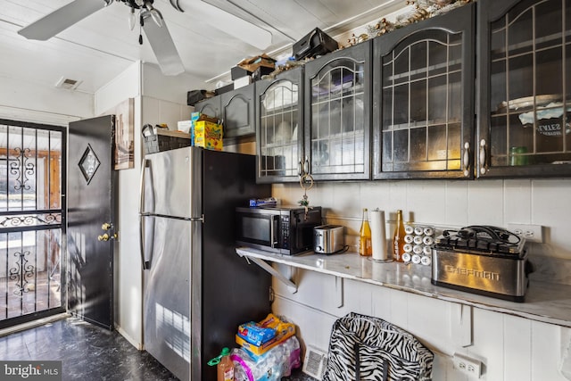 kitchen featuring stainless steel fridge and ceiling fan