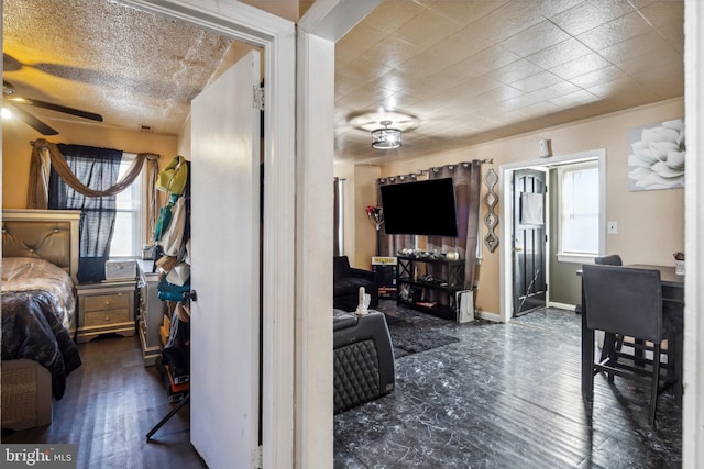 bedroom with dark hardwood / wood-style floors and ceiling fan