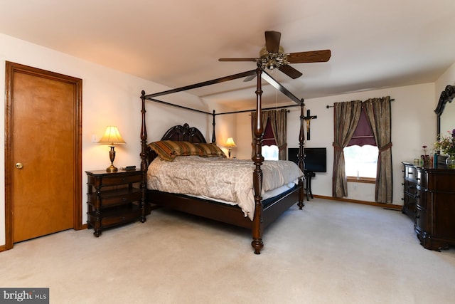 bedroom with light colored carpet and ceiling fan