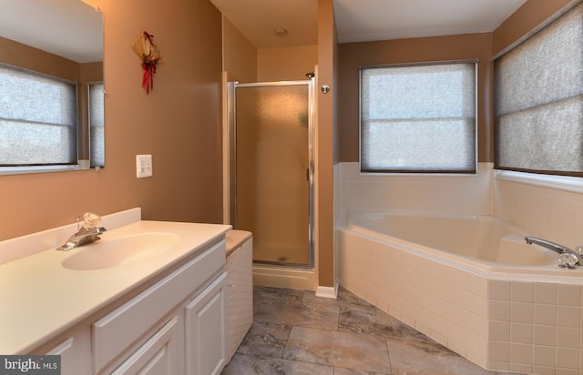 bathroom with separate shower and tub and vanity