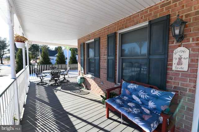 wooden terrace featuring a porch