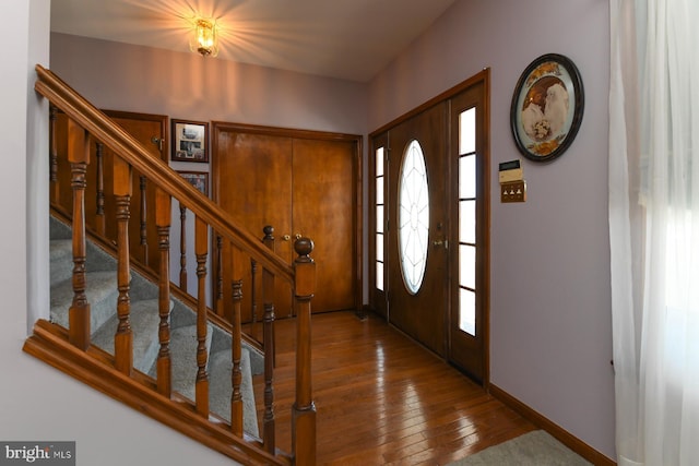 entryway with dark wood-type flooring