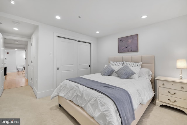 carpeted bedroom with a closet