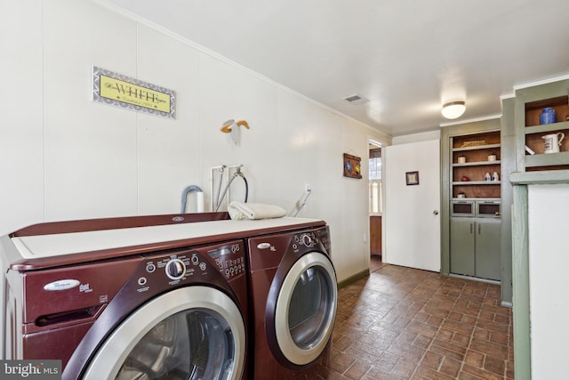 clothes washing area with washer and dryer