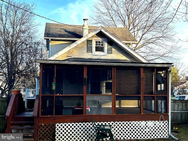 back of property featuring a sunroom