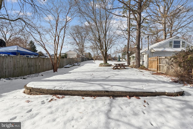 view of yard layered in snow